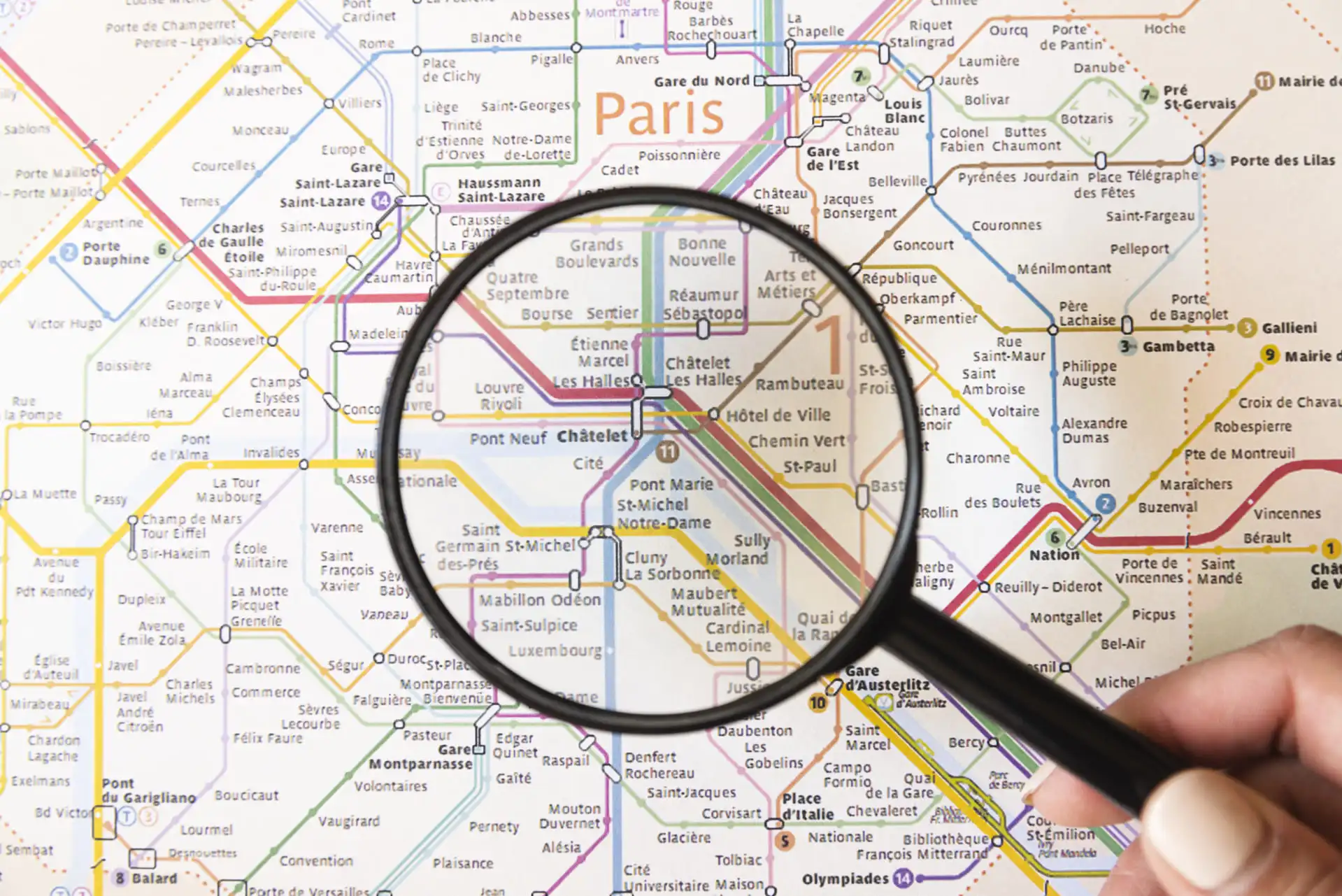 Map of the Paris transport network, with a magnifying glass