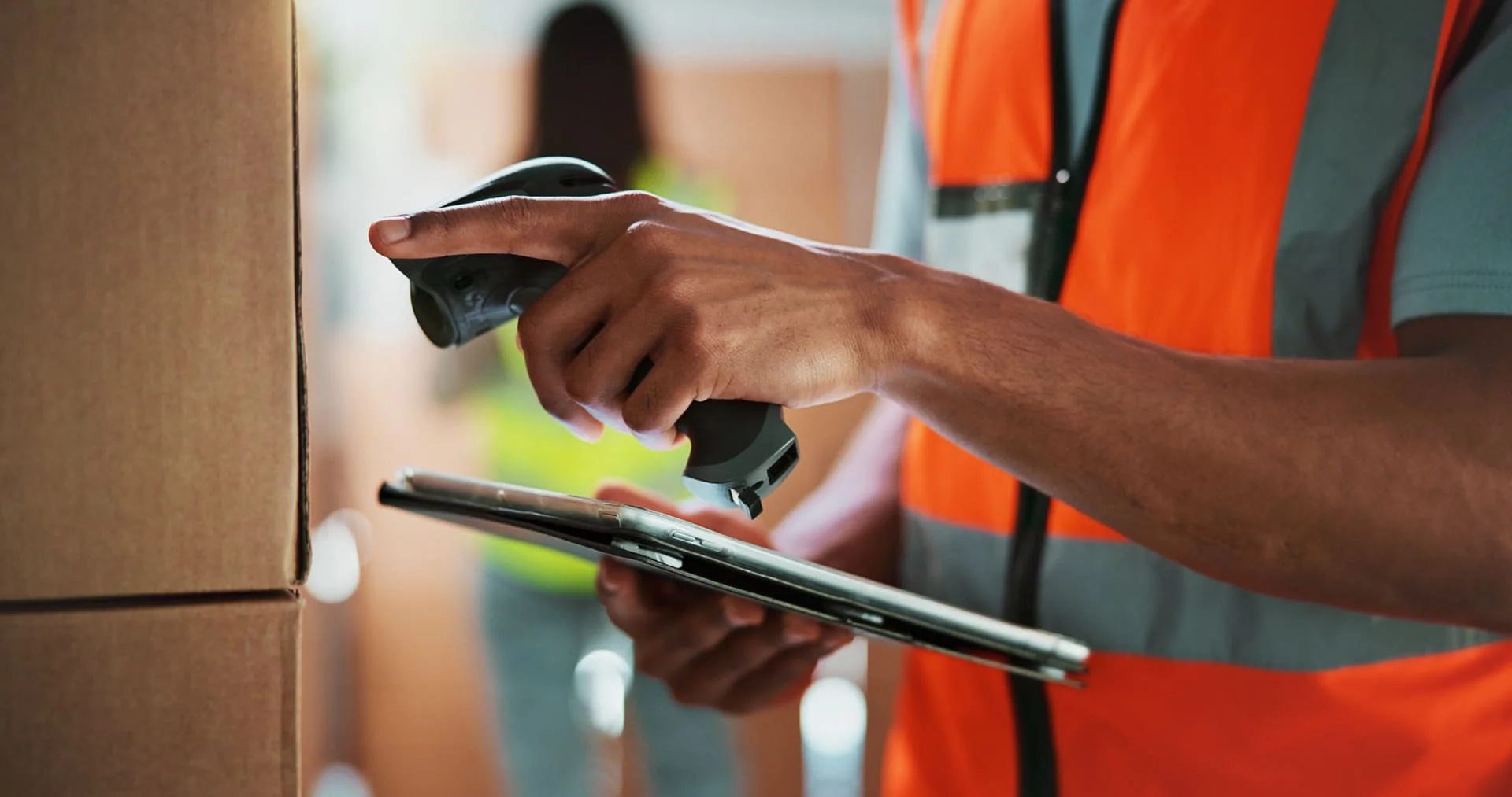 Person with scanner and tablet in hand to track coli