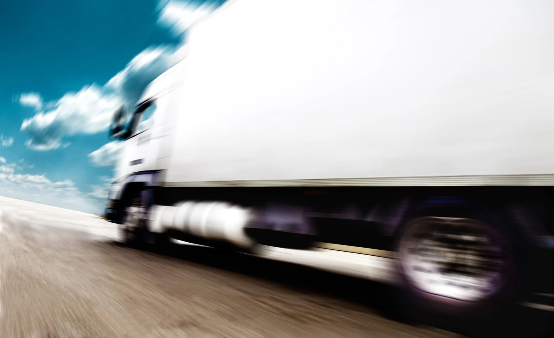 White truck on the road with speed effect