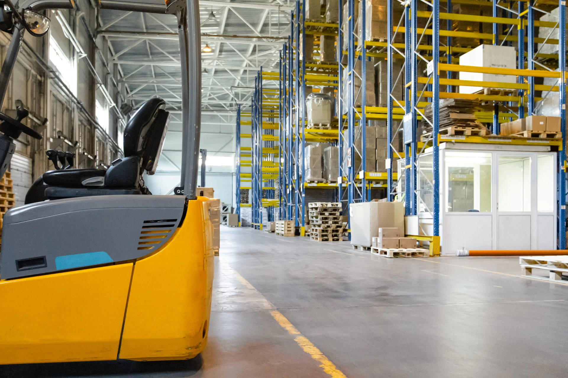 Interior of a warehouse with a forklift truck